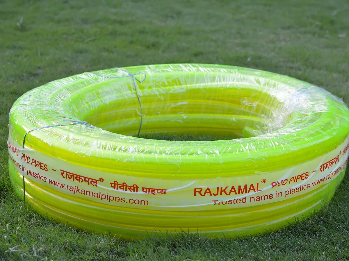 Yellow-green colour transparent garden pipe coil