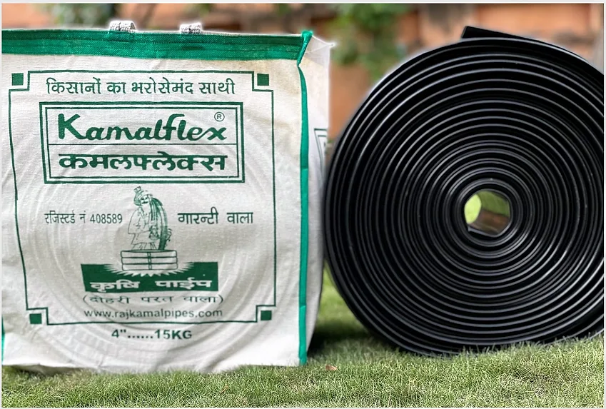 Kamalflex Krishi bag next to a roll of black lay flat pipe